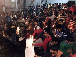 People participating in candle light march for paying homage to victims of chopper crash at Katra.