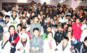 Medal winners of Taekwondo Championship posing for a group photograph alongwith the chief guest, Kavinder Gupta and other dignitaries on Monday.  