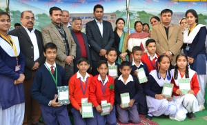 Winners of symposium and slogan writing competition              posing for a group photograph alongwith dignitaries at Udhampur on Wednesday. 