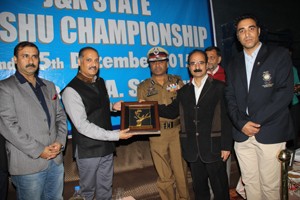 Distribution of mementoes during opening ceremony of 12th State Wushu Championship in Jammu on Thursday.