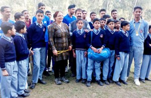 Winners of cricket match for physically challenged posing for a group photograph alongwith officials on Thursday.