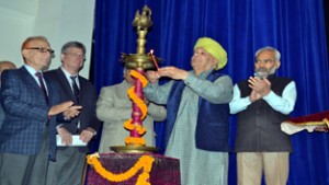 MLC, Ashok Khajuria lighting ceremonial lamp during inaugural of an international seminar at JU on Thursday.