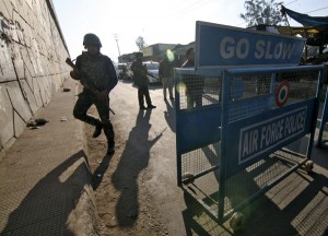 Security personnel stand guard next to a barricade outside the Indian Air Force (IAF) base at Pathankot on Saturday. (UNI)