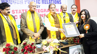 J&K Assembly Speaker felicitating District Secretary Human Rights Tarika Mahajan during a seminar at Press Club, Jammu.