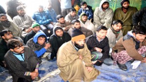 Forest smugglers, who surrendered before police and Forest Department in Rafiabad. -Excelsior/Aabid Nabi