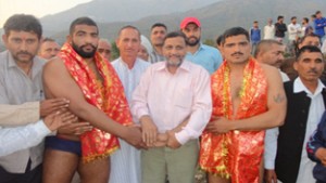 Wrestlers being felicitated by Shiv Kumar Sharma, Joint Secretary J&K State Sports Council at Katra on Monday.