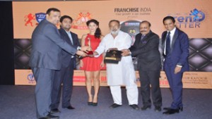 Bharat Choudhary and Amit Choudhary receiving the award at Delhi.