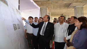 Minister for Rural Development, Abdul Haq Khan having a look at drawings of District Court Complex Samba on Thursday.