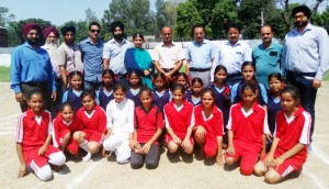 Players posing for a group photograph alongwith dignitaries and officials during Inter-School Tournament in Jammu on Friday.