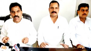 NPP chairman Harshdev Singh (L) addressing press conference in Jammu on Saturday.