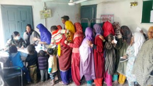Women patients standing in queue at the medical camp. 