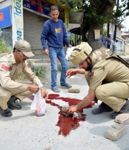 Cops remove blood from Zadibal, where two cops were killed by militants on Monday. (More pics on page 6)  —Excelsior Photo