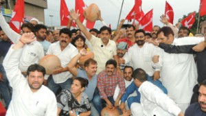 NC activists staging protest outside PHE office in Jammu on Monday.
