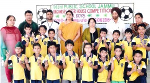Players of winning team posing for group photograph with dignitaries.