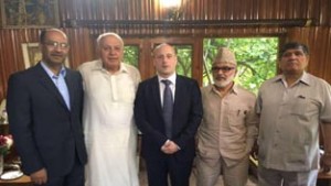 Former Chief Minister Dr Farooq Abdullah and other senior NC leaders during meeting with British envoy Dr Alexander in Srinagar on Monday.