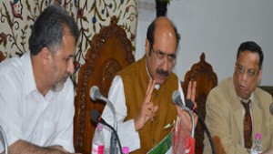 Revenue Minister Basharat Bukhari reviewing functioning of department. 