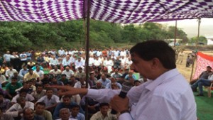 MLA Udhampur addressing a public meeting at Jib on Monday.