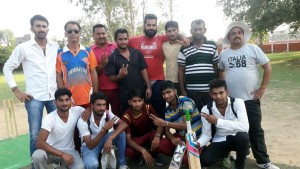 Players of winning team posing for photograph.