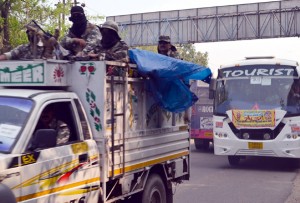Security personnel escorting Amarnath yatra convoy as yatra resumed after three days from Jammu on Monday. -Excelsior/ Rakesh