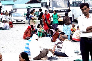 Stranded pilgrims at Pahalgam on Tuesday. -Excelsior/Sajad Dar
