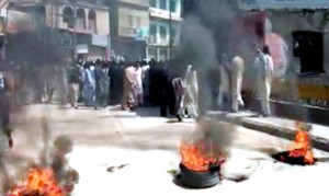 Protesters burn tyres in Muzaffarabad, PoK against  rigging in Assembly election on Wednesday. 
