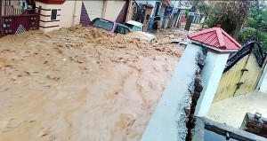 Vehicles trapped in flash flood in Janipur area of Jammu on Wednesday.