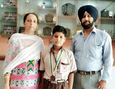 Sourav Gupta a bronze medalist student of Vishwa Bharti School posing with Principal, Prof. Annapurna Koul and Sports teacher, Joginder Singh.