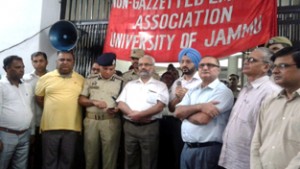 DC Jammu, Simrandeep Singh announcing about agreement between JU and NGEU on Wednesday in presence of Vice-Chancellor, DIG Jammu - Kathua Range and employees leaders.