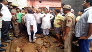 BJP State chief, Sat Sharma during his visit to flood hit area of Janipura on Wednesday.
