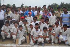 Minister for Industries and Commerce Chander Prakash Ganga and players posing for a group photograph.