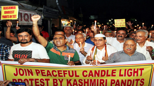 KP leaders during candle light procession at Jammu on Saturday.