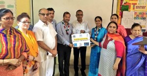 Dr Seema Rohmetra, Co-ordinator, GPF Jammu receiving Humanitarian Award of the year from president, GGF J&K, S P Varma and others.