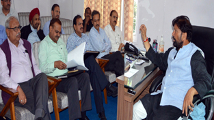 Forest Minister, Choudhary Lal Singh chairing a meeting at Srinagar on Saturday.