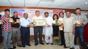 Speaker Kavinder Gupta releasing Bhaint DVDs during a function by Nami Dogri Sanstha on Saturday.