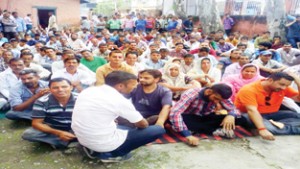 PHE daily wagers staging protest demonstration at Udhampur on Friday.