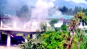 Smog billows out of under-construction Mini Secretariat building as security forces launched final assault against the militants in Poonch on Tuesday. -Excelsior/Harbhajan