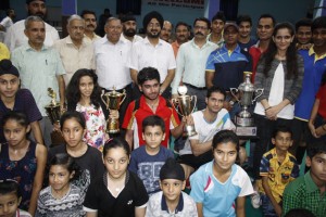 Winners in various categories of Jammu District Badminton Championship posing with DC Jammu Simrandeep Singh and other dignitaries.— Excelsior/Rakesh