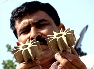A man shows mortar shells fired by Pakistan in Hiranagar sector of Kathua district. —Excelsior/Madan