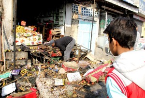 A fruit shop was gutted in a petrol bomb attack by unidentified persons at Lal Bazar in Srinagar on Friday.  —Excelsior/Shakeel