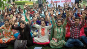 Home Guards staging protest dharna at Jammu on Friday. -Excelsior/ Rakesh