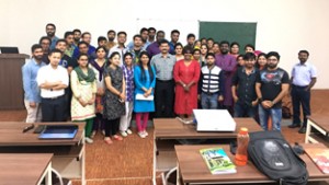 Students of CUJ's Department of National Security posing for a group photograph with guest speaker on Friday. 