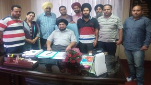 Newly elected body of OT Technicians posing for photograph with Director Health Services Jammu, Dr Gurjeet Singh on Friday.
