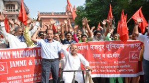 Nirman Mazdoor Union workers holding protest at Labour Deptt office in Jammu on Friday.  —Excelsior/Rakesh