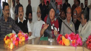National Conference President, Dr Farooq Abdullah addressing party workers at Surankote on Friday.