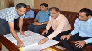 Speaker Legislative Assembly Kavinder Gupta being briefed by an officer on Saturday.