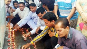 BJP leaders paying tributes to martyrs at Rajinder Park Jammu by lighting the earthen Diyas.