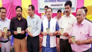 Minister of State for Finance Ajay Nanda and others releasing Handbook-cum-Diary on Friday.