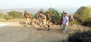 Cops and civilians rush to the site of shelling to rescue injured in Mendhar sector on Monday.