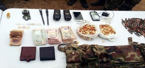 Arms, ammunition and cash recovered from militants at Naidkhai, Bandipora on Friday. -Excelsior/ Sajad Dar