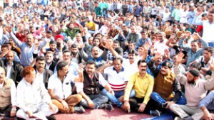 State Govt employees and pensioners staging protest dharna outside Divisional Commissioner's office in Jammu on Tuesday. -Excelsior/Rakesh